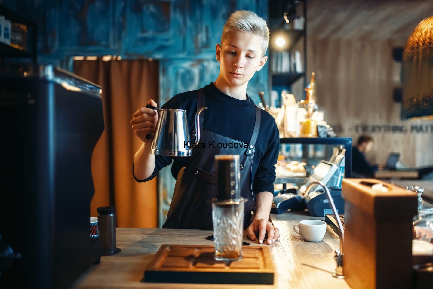 Barista Pours Water From Coffee Pot